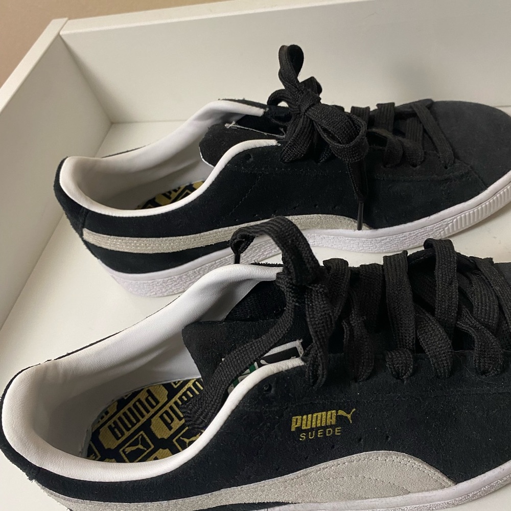 Puma black shoes.